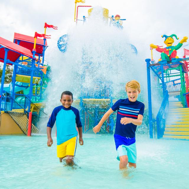 Two kids playing at the Joaker Soaker in the Water Park at  LEGOLAND Florida Resort