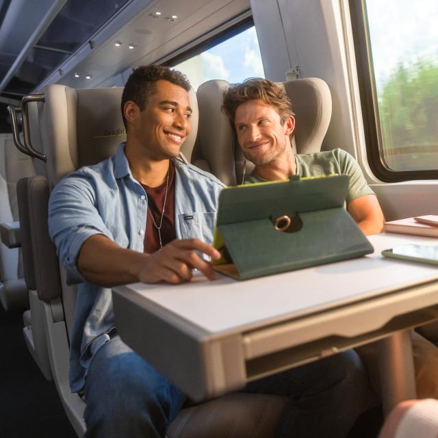 Guys riding on Brightline train