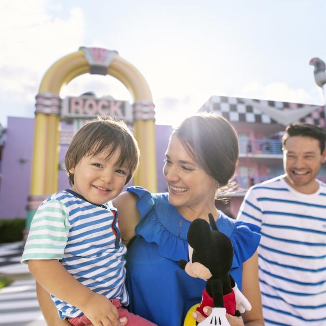 Disney's All-Star Music Resort family in front of resort