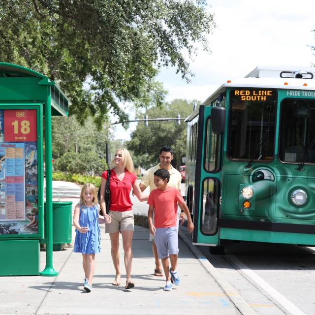 I-Ride Trolley Services family at bus stop