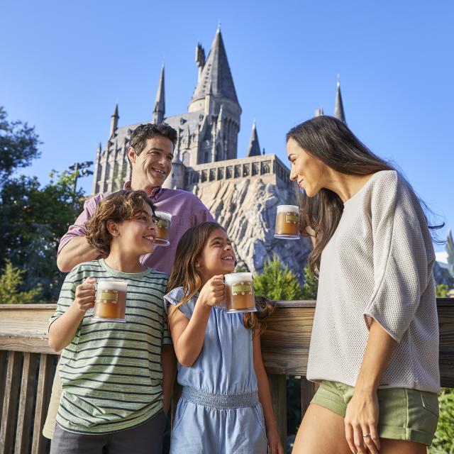 hispanic family drinking butter beer in hogsmeade