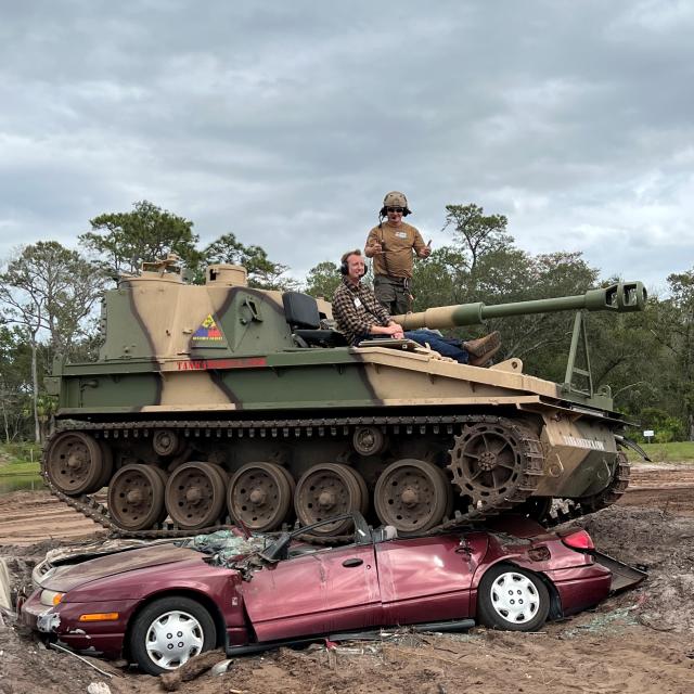 Tank America Media Event tank on top of a crushed car