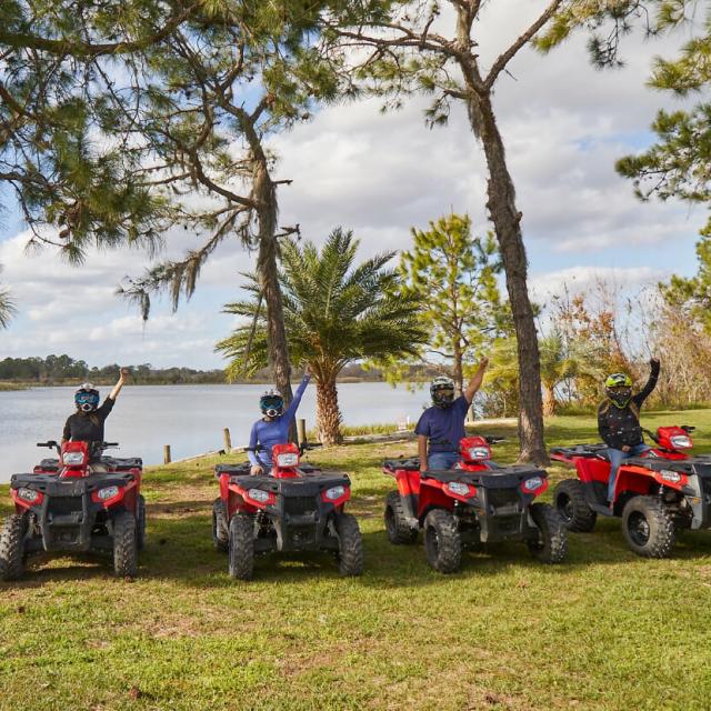 Revolution Off Road group of ATV riders by water